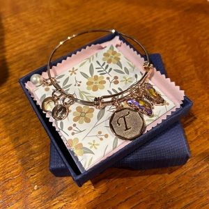 Butterfly charm bracelet with the letter 'T'